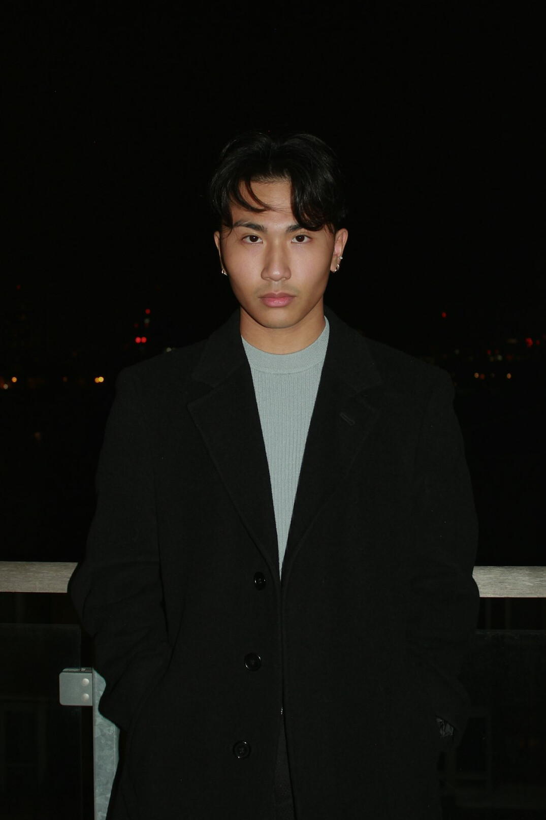 Portrait of a man in a dark jacket with a slight smile