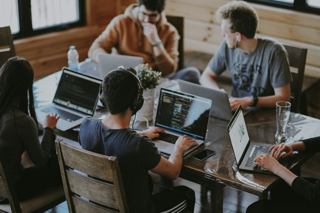 software developers coding together